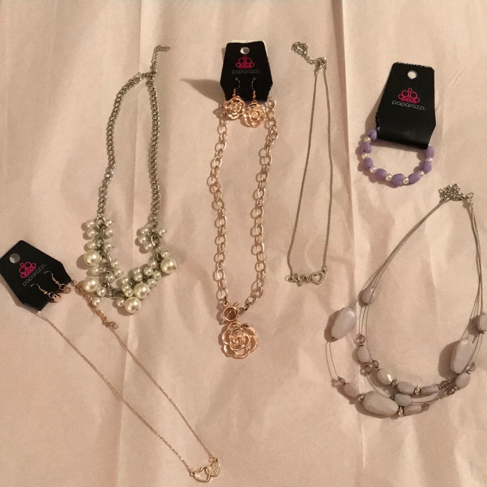 Five Paparazzi necklaces and one child’s bracelet